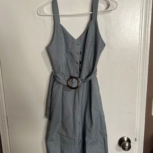 Blueish green grey color very pretty brown buttons on front and adjustable belt